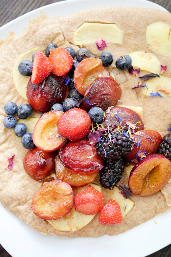 Oven pancakes with berries and plums